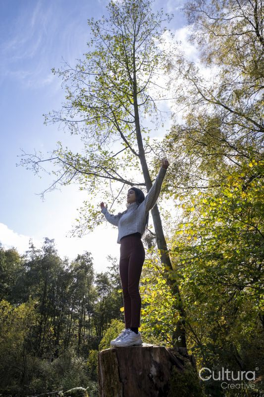 Woman meditating in forest