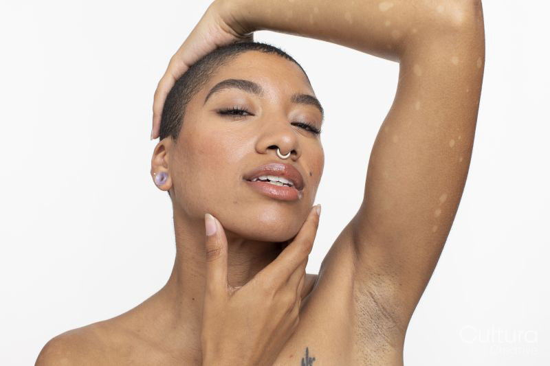 Studio portrait of woman with short hair and nose ring
