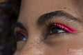 Close up of pink makeup on woman's closed eyes