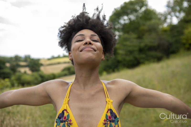 Young woman relaxing in meadow