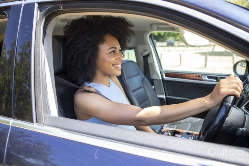 Young woman driving car