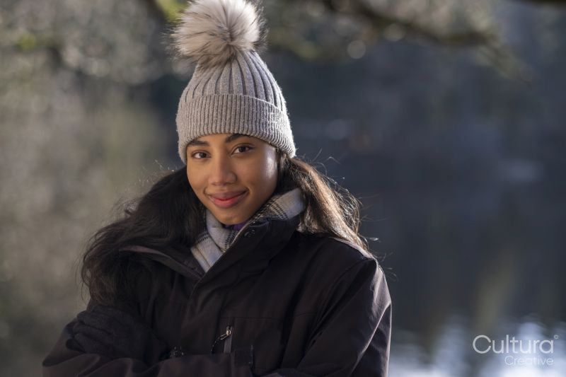 Portrait of smiling young woman in hat