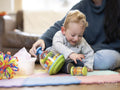 Boy reaching for toy