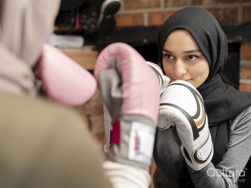 Two women training boxing