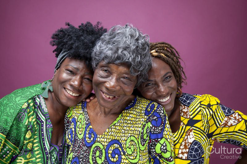 Studio portrait of senior woman with mature daughters