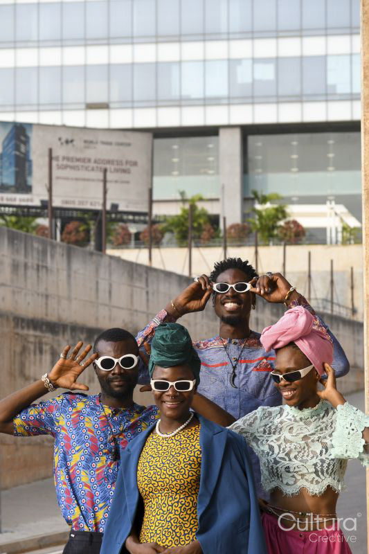 Fashion portrait of four people in urban street