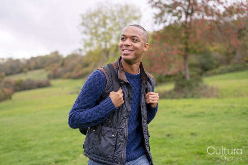 Man smiling during nature walk