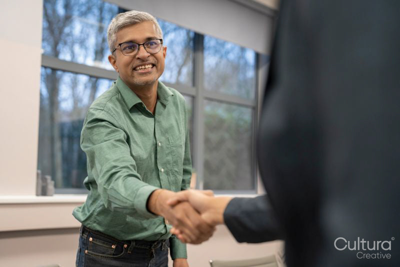 Business people shaking hands during meeting