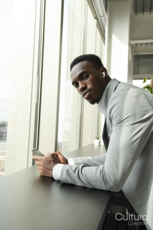 Portrait of young businessman using smart phone