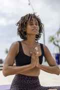 Woman meditating outdoors
