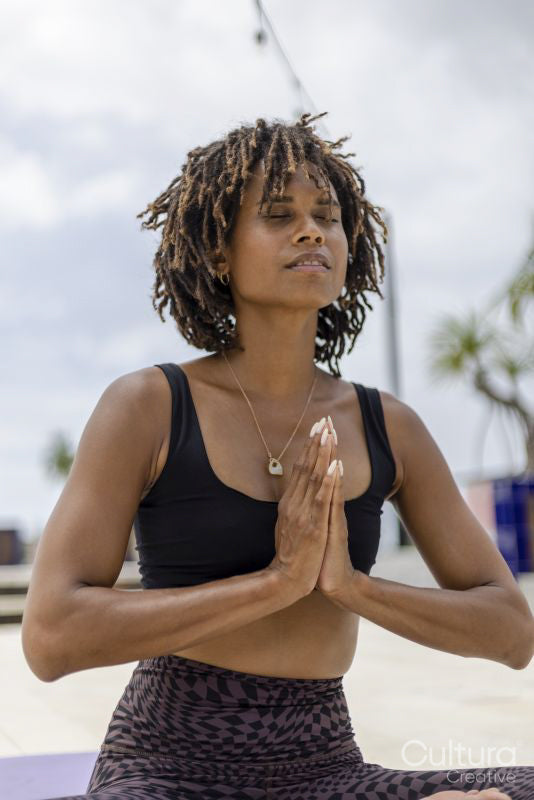 Woman meditating outdoors
