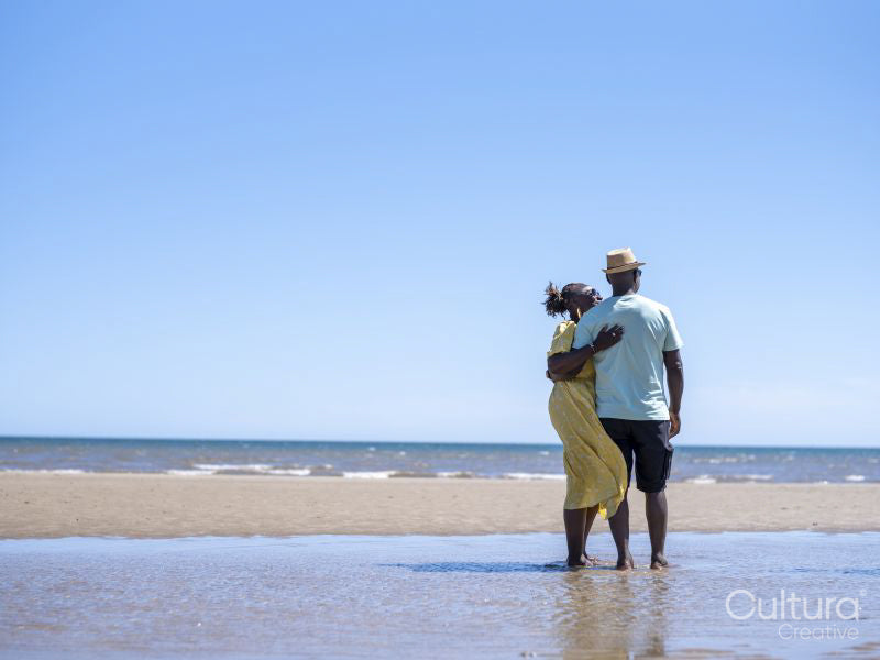 Mature couple standing on beach