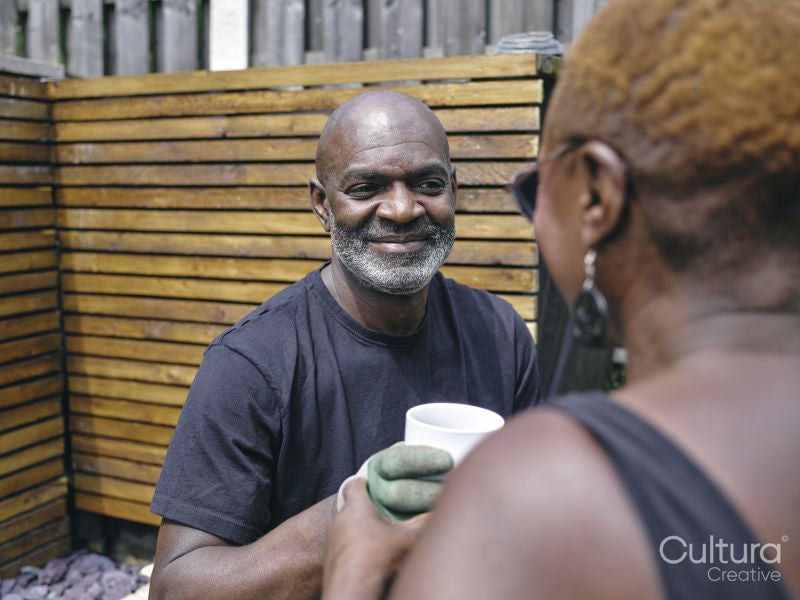 Couple drinking coffee on patio