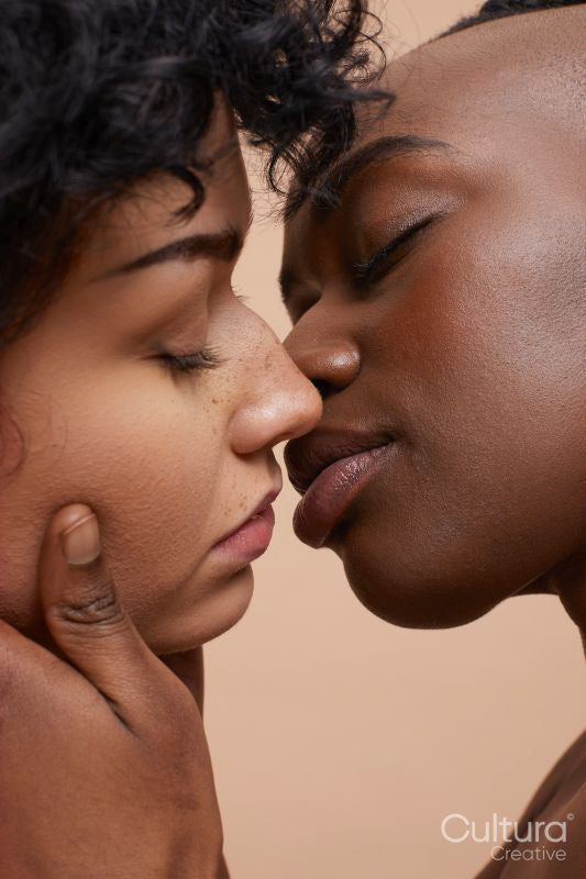 Studio portrait of couple kissing