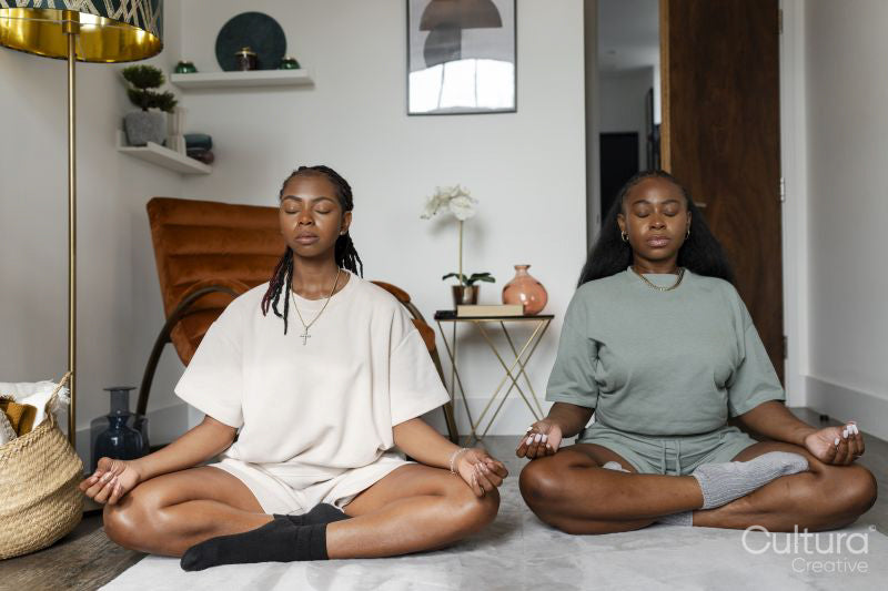 couple practicing yoga at home