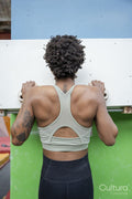 Rear view of woman exercising on climbing wall
