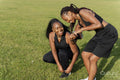 Young female friends getting ready to exercise in park