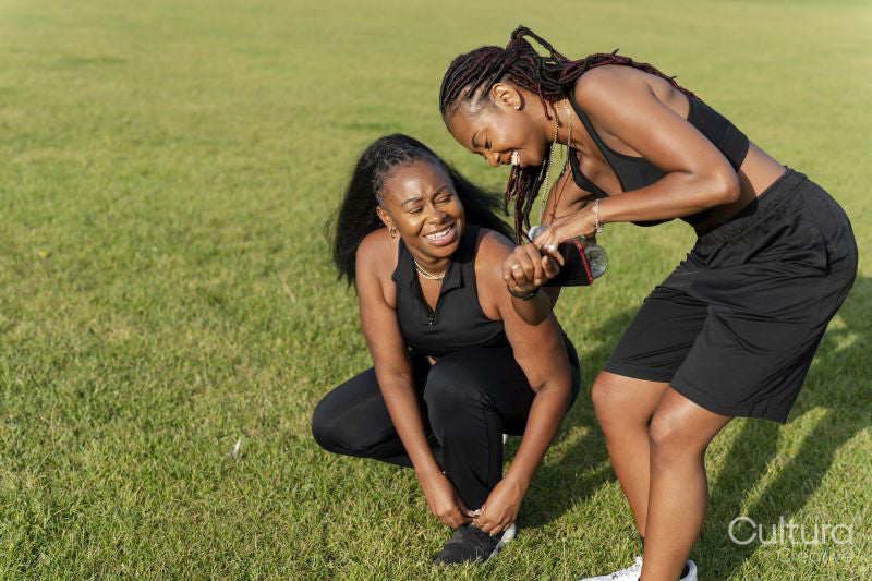 Young female friends getting ready to exercise in park