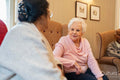 Senior women sitting in room and talking