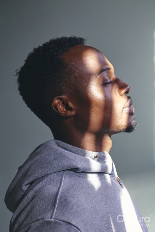 Profile of mid adult man in sweatshirt