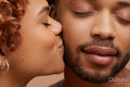 Studio portrait of kissing couple