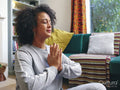 Woman practicing yoga at home