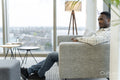 Man resting in office lobby