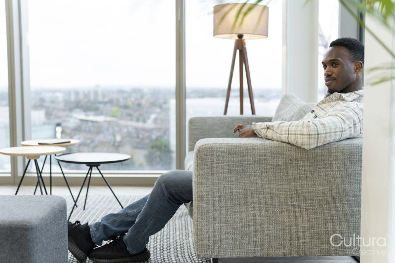 Man resting in office lobby