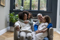 Smiling women with daughters at home