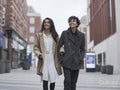 Female couple walking in street