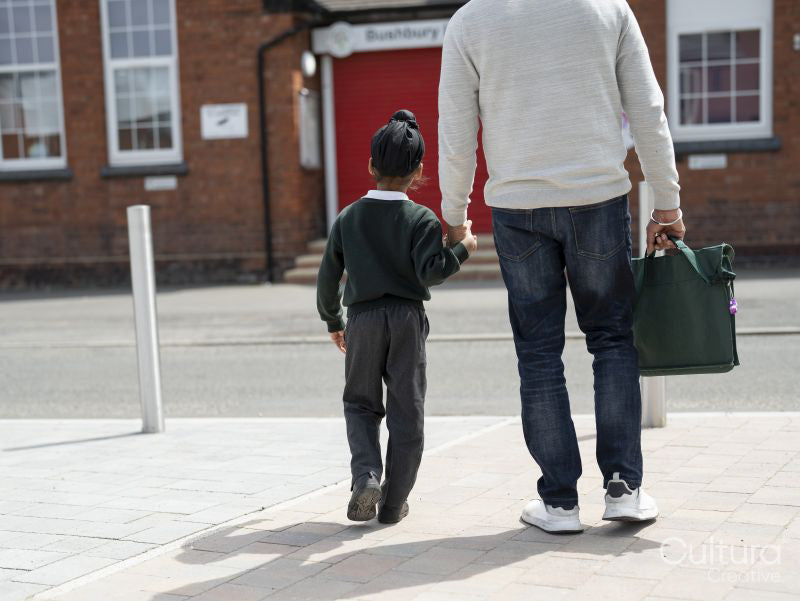 Father walking son to school