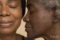 Close-up of two women with eyes closed