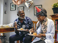 Man and woman eating at birthday party