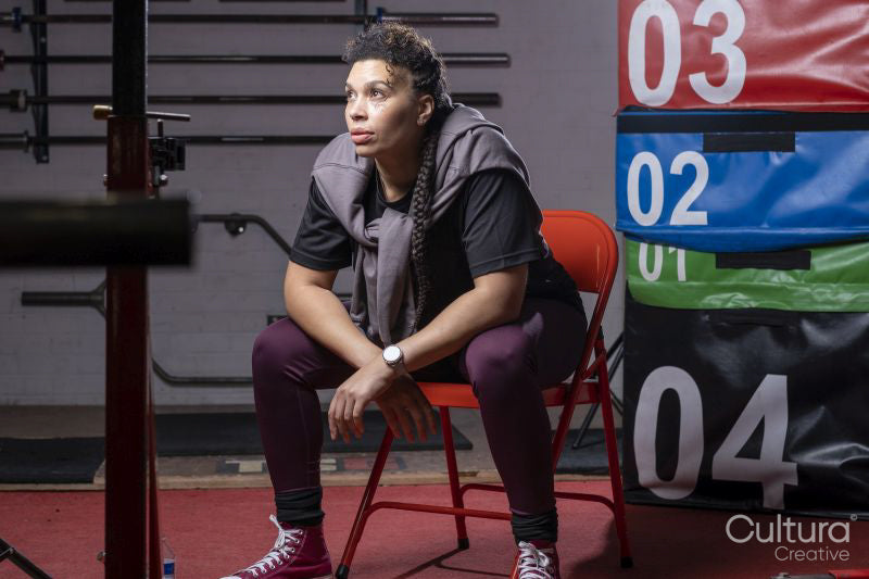Portrait of woman sitting in gym