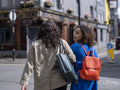 Rear view of couple walking on street