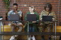 Creative professionals working together in office lounge