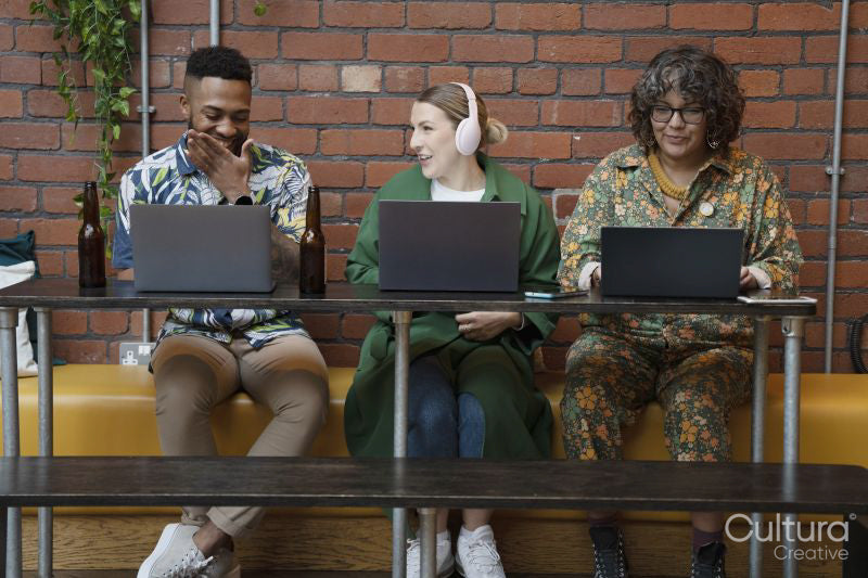 Creative professionals working together in office lounge