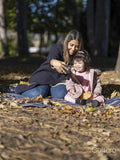 Mother and daughter with Down syndrome taking selfie in park