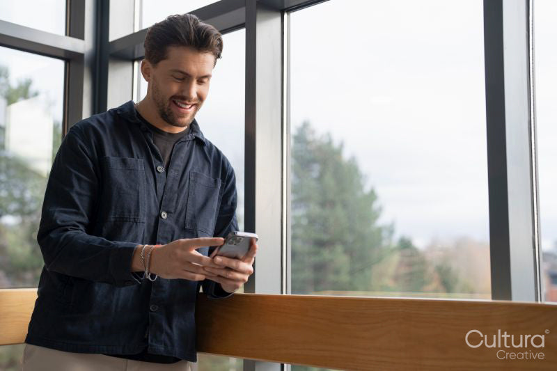 Businessman using phone in office