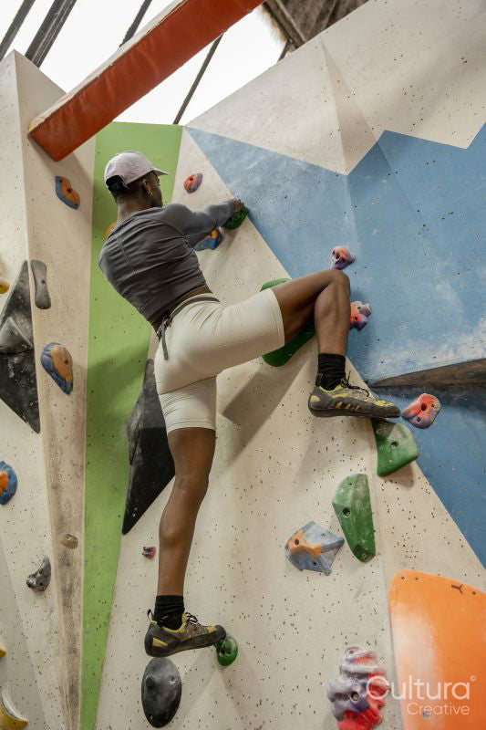 Woman on climbing wall