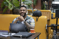Portrait of man sitting in office lounge