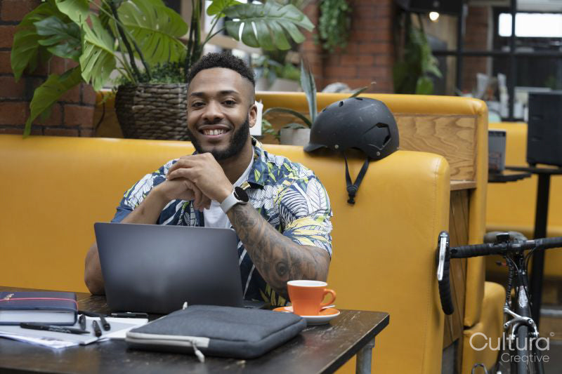 Portrait of man sitting in office lounge