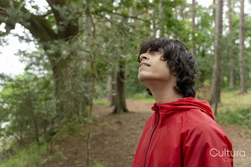 Young man hiking in forest
