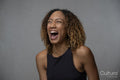 Portrait of laughing woman with curly hair