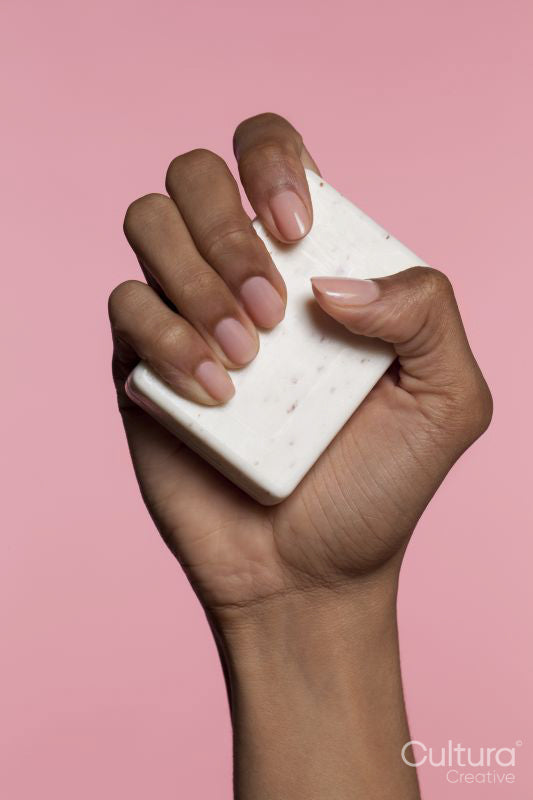 Woman holding bar of soap