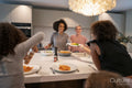 Family enjoying dinner in kitchen