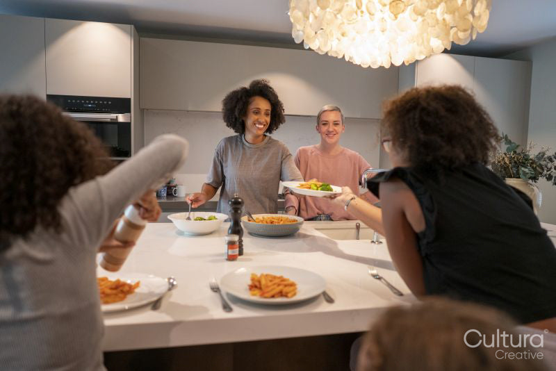 Family enjoying dinner in kitchen