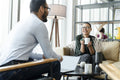Business people having meeting in office lobby