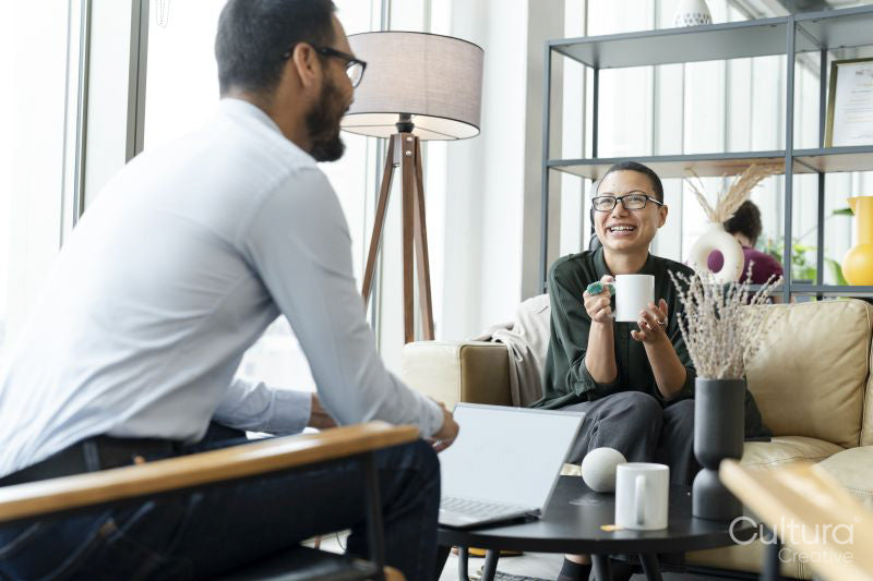 Business people having meeting in office lobby