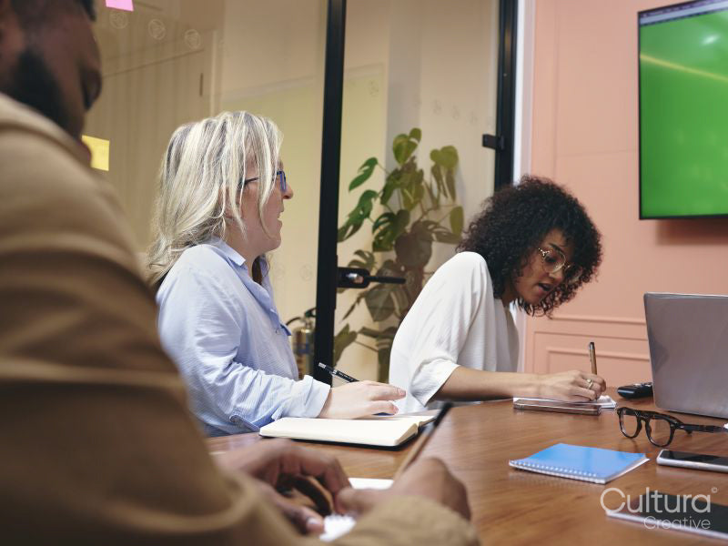 Workers having meeting in office